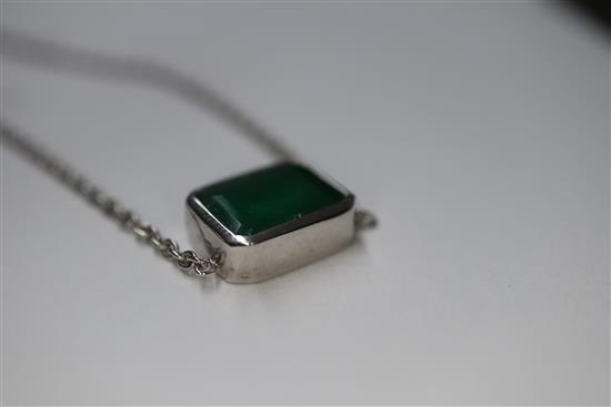 An 18ct white gold and solitaire emerald set pendant necklace, pendant 9mm.